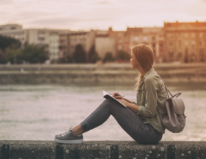 Girl sitting on ledge. Curious, curiosity, mind management, resilience, life coaching